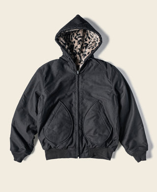 Reversible deck jacket in black with hooded leopard-print lining and zip front pockets
