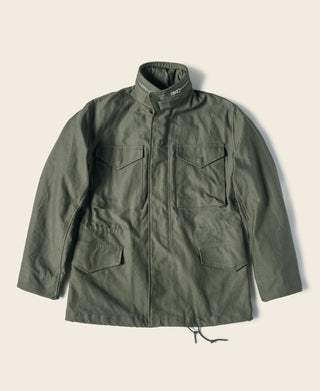 Olive field jacket with button front, stand collar, and two chest flap pockets.