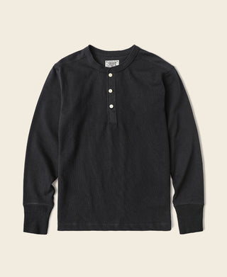 Black long-sleeve henley shirt with short button placket and three front buttons.