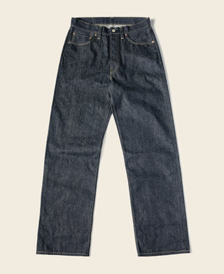 Indigo selvedge denim jeans with straight legs, button fly, and five-pocket styling.
