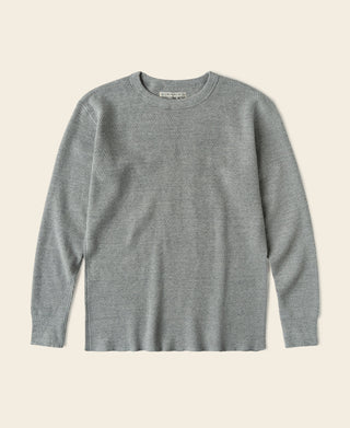 Gray waffle thermal knit shirt with crew neck and long sleeves, ribbed cuffs and hem