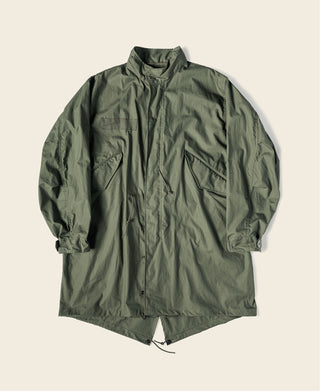 Olive green M-65 style parka with button-front and drawstring hem