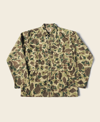 Camouflage jacket laid flat, button-front with long sleeves and chest pockets