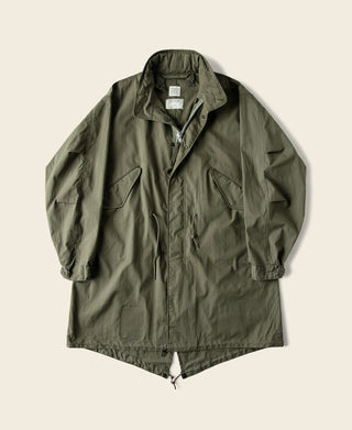 Olive M-65 style parka with front zipper, snap buttons, and flap chest pockets
