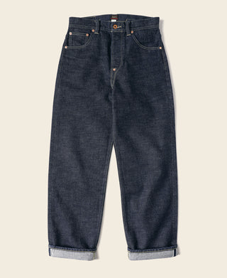 Indigo selvedge denim jeans with dark wash, copper buttons, straight legs