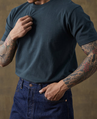 Dark vintage cotton T-shirt with crew neck and short sleeves, front view on model