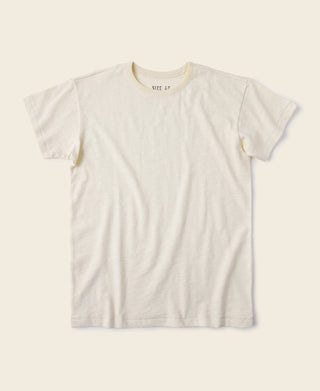 Light apricot crew-neck slub cotton T-shirt with short sleeves and ribbed collar