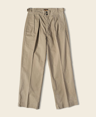 Khaki combat pants with drawstring waist and front button placket