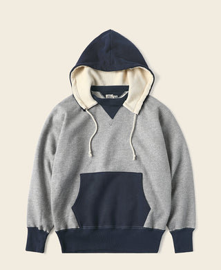 Two-tone hooded sweatshirt, gray body with navy hood and kangaroo pocket