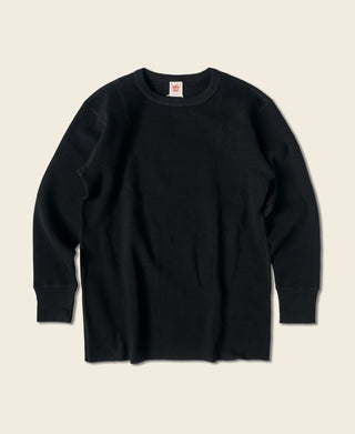 Black waffle-knit long-sleeve cotton top with crew neck
