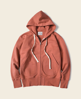 Brick red terry cloth full-zip hoodie, front view with two chest pockets and hood