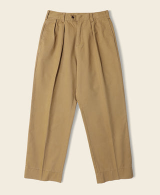 Yellow chino trousers flat lay with pleated front and gathered waistband
