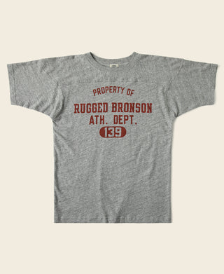 Gray drop-shoulder crew T-shirt with red “PROPERTY OF RUGGED BRONSON” graphic