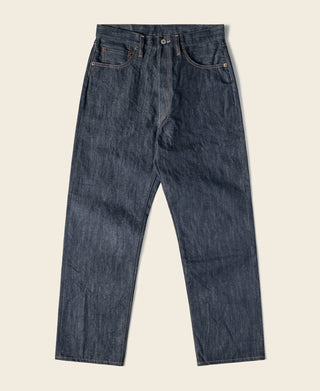 Dark blue denim jeans with button-fly closure and straight, relaxed leg