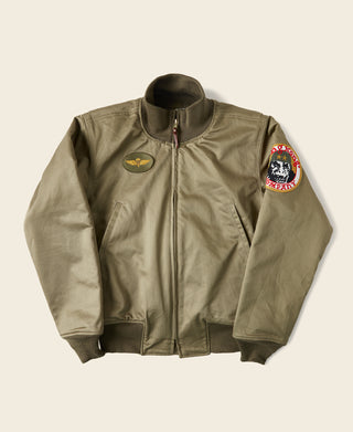 Olive bomber jacket with zip front and embroidered chest and sleeve patches, knit collar.