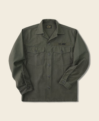 Olive fatigue utility shirt with button front, flap chest pockets, and long sleeves