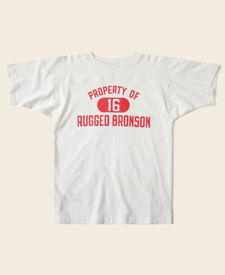 White drop-shoulder T-shirt with red 'PROPERTY OF 16 RUGGED BRONSON' graphic
