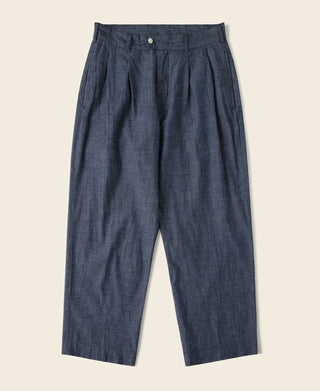 Indigo double-pleated chambray pants with button waist and straight legs