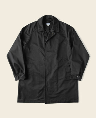 Black all-weather trench coat with front button closure and storm placket