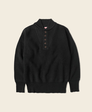 Black wool high-neck sweater with short button placket, ribbed cuffs, and hem