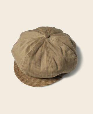 Khaki biker cap with rounded crown and ribbed fabric brim.