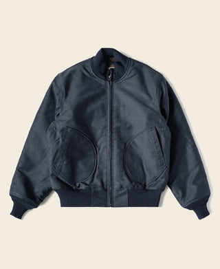 Navy deck jacket with front zipper and two flap chest pockets, ribbed cuffs