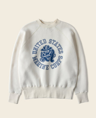 White pullover raglan sweatshirt with blue “United States Marine Corps” devil dog graphic.