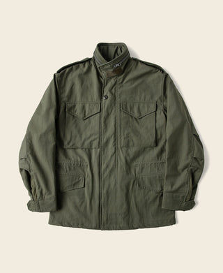 Olive field jacket with button front and two chest flap pockets
