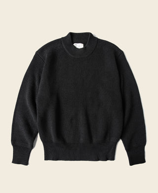 Black wool crewneck sweater with ribbed cuffs and hem, pullover style