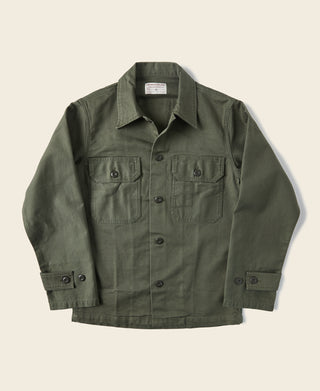 Olive fatigue utility shirt with button front, pointed collar, and chest flap pockets
