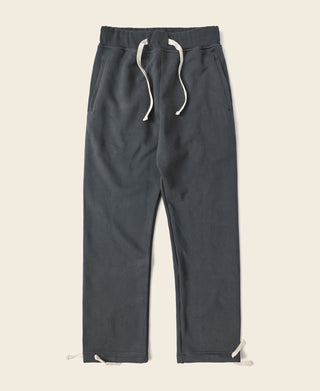Black terry sweatpants, drawstring waist and straight legs, cuffed hems