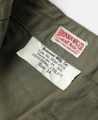 Olive utility pants inner label and brand tag on the waistband