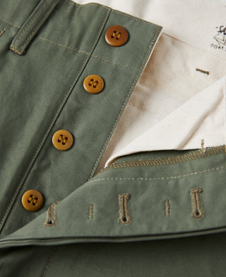Olive officer trousers front with button fly, stitching, and waist facing