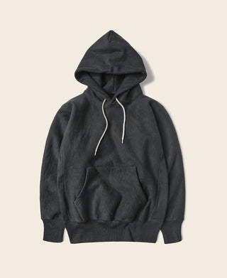 Black pullover hoodie with hood and white drawstrings