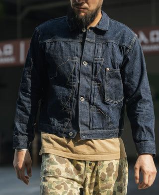 Indigo denim jacket with front buttons and flap chest pockets, yellow contrast stitching