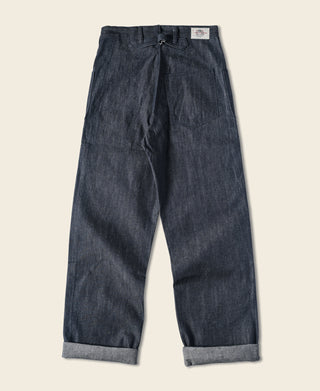 Dark navy denim pants on white background, straight leg fit with cuffed hems