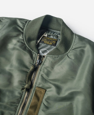 Olive MA-1 flight jacket close-up of front zipper, collar, and interior label