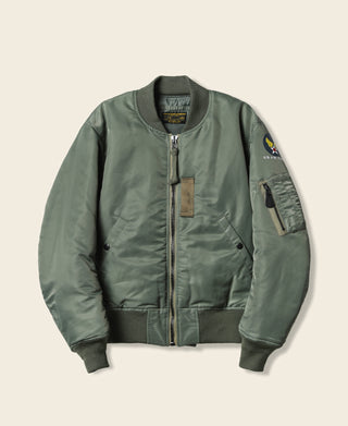 Olive MA-1 flight jacket front view with zip closure, pocket, and sleeve patch