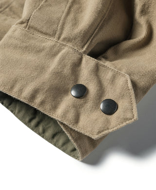 Khaki cotton twill field pants cuff with two snap buttons and folded hem