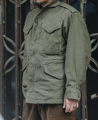 Olive field jacket utility pockets with drawstring waist detail