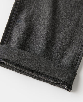 Salt and pepper trousers hem cuff with dark topstitching and stitched fabric edge