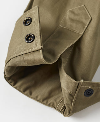 Khaki green jacket sleeve cuff with two metal snaps and open hem