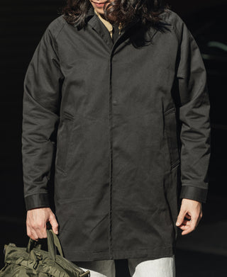 Black all-weather trench coat with hood, zip front, and two front pockets