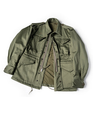Olive field jacket with multiple chest pockets and buttoned front, full garment view
