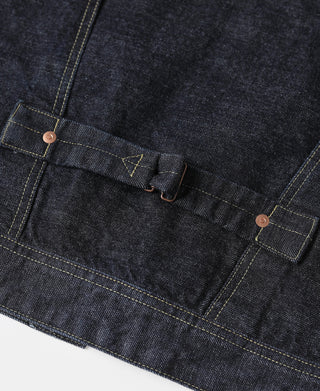 Indigo denim jacket front pocket flap with copper buttons and yellow stitching