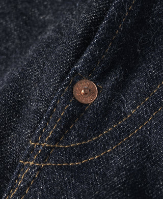 Indigo selvedge denim jeans—copper button on pocket with curved topstitching