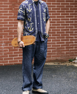 Indigo chambray double-pleated pants worn, full-length view