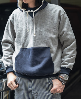 Two-tone hooded sweatshirt, gray with navy front pocket, adjustable hood with drawstrings