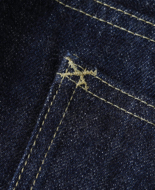 Indigo selvage denim jeans corner seam with yellow contrast stitching