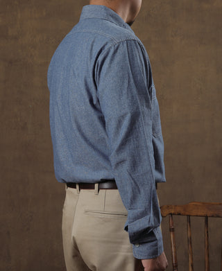 Blue chambray work shirt with long sleeves and single-button cuff